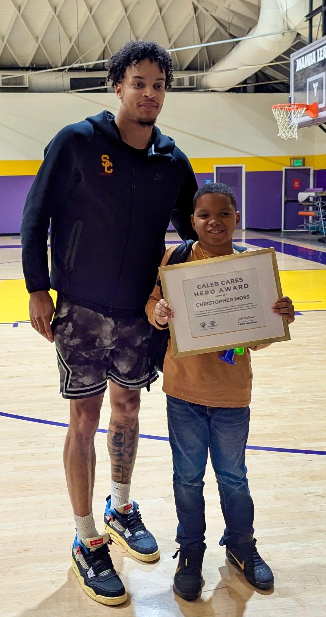 Caleb Williams with Hero Award winner Christopher Moss
