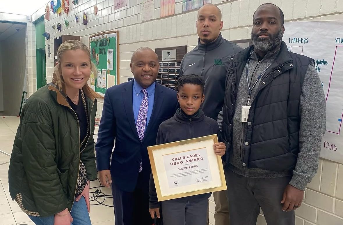 Hero Award winner Julien Louis with his framed certificate